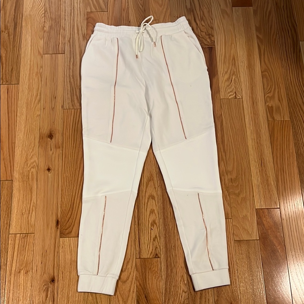 Run way white joggers with copper zipper design